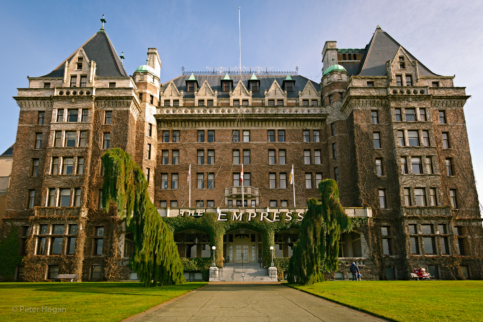 A grand, old-style hotel with brick walls and gables.