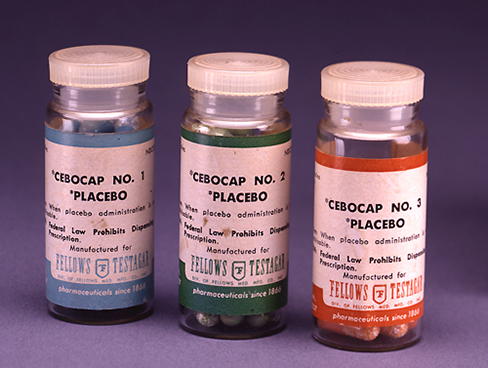 Three pill bottles are displayed. The labels on the bottles read ‘Cebocap No. 1 placebo’, ‘Cebocap No. 2 placebo’, and ‘Cebocap No. 3 Placebo’ respectively.